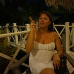 Girl enjoys Cuban ciagr