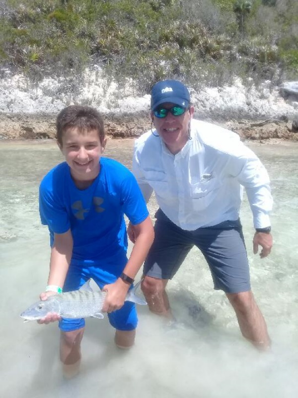 Kids fly fishing Bahamas Nassau